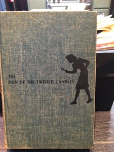 The Sign of the Twisted Candles